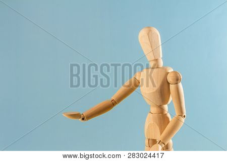 Wooden Doll As A Model For Drawing On A Neutral Background. Concept Of Asking For Help, Sadness, Lon