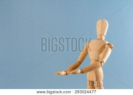 Wooden Doll As A Model For Drawing On A Neutral Background. Concept Of Asking For Help, Sadness, Lon