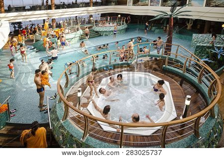 Passenger Ferry, Midsea, Spain - June 09, 2012: Passengers Enjoy At Swimming Pool On Upper Deck Of T