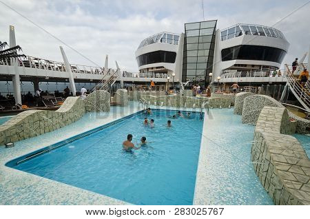 Passenger Ferry, Midsea, Spain - June 09, 2012: Passengers Enjoy At Swimming Pool On Upper Deck Of T