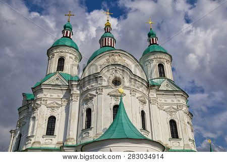 Cathedral Of The Nativity Of The Blessed Virgin. Kozelets. Ukraine. Domes Close-up On Cloudy Sky Bac