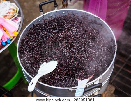 Traditional Thai Black Steamed Sticky Rice In Hot Steamer, Delicious Wholegrain Alternative To White