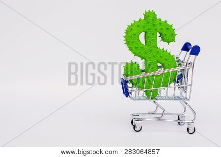 American Dollar Rubber Toy In A Mini Grocery Cart On A White Background. Copy Space.