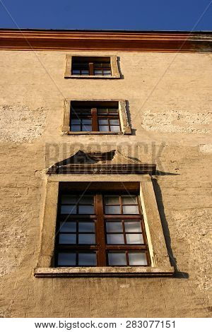 Windows Of An Old Building Withblue Sky