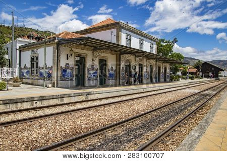 Pinhao, Portugal - June 27, 2017 - Train Tracks Lead Into Station With Famous Mural Tiles