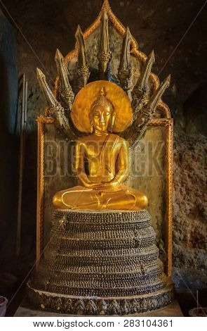 Phang Nga, Thailand - January, 25th, 2014: Golden Statue Of Buddha In Meditation With Protective Nag