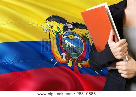 Learning Ecuadorean Language Concept. Young Woman Standing With The Ecuador Flag In The Background. 