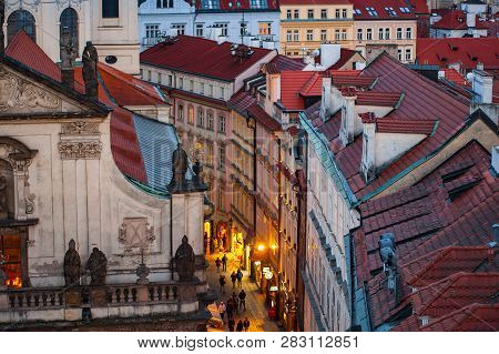 View On The Roofs And Street In Stare Misto. Prague. Sunset