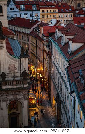 View On The Roofs And Street In Stare Misto. Prague. Sunset
