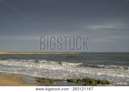Breakwater In Santa Pola. It Is A Coastal Village Located In The Comarca Of Baix Vinalopo, In The Va