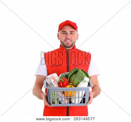 Delivery Man Holding Plastic Crate With Food Products On White Background