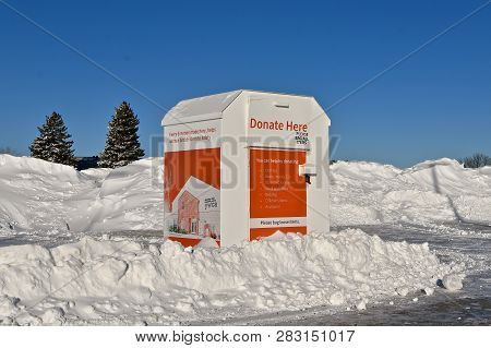 Moorhead, Minnesota, February 7, 2019: The Donation Box Surrounded By Snow Belongs To The Ywca, The 