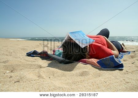 girl sleeping in the beach