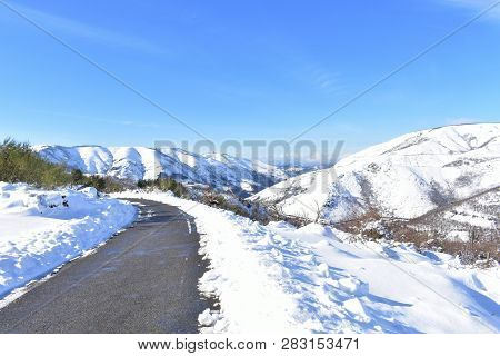 Winter Landscape With Road And Snowy Mountains. Sunny Day, Blue Sky. Ancares Region, Lugo Province, 