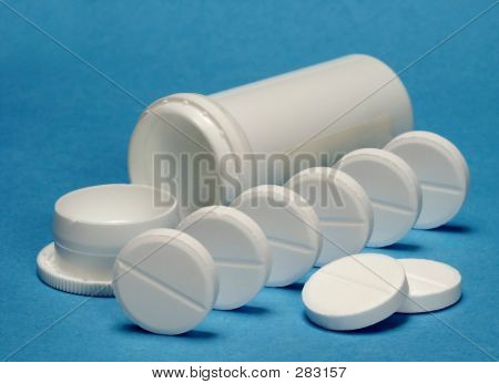 Weiße Tabletten mit Container