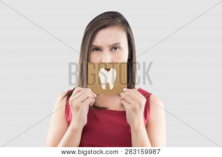 Asian Woman In The Red Shirt Holding A Brown Paper With The Caries Cartoon Picture Of His Mouth Agai