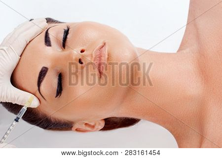 Face Lifting. Portrait Of Beautiful Woman Face With Perfect Smooth Skin Receiving Hyaluronic Collage