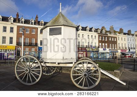 Weymouth, Dorset, Uk - December 26, 2017. A Vintage Changing Hut, Bathing Machine, Used By Swimmers 