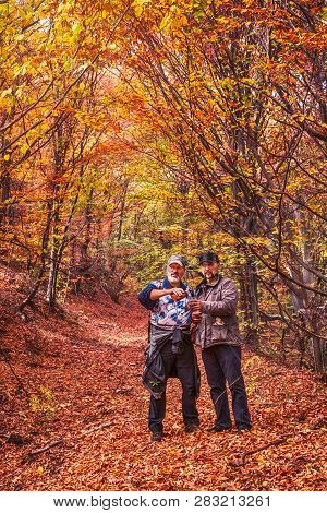 Fantanele Village, Romania - Octomber 20, 2018. Two People In The Fall Forest, Near The Fantanele Vi