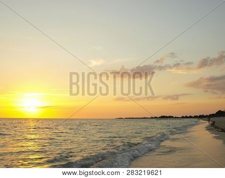 Playa Ancón, Espíritu Santo, Cuba - June 28, 2018: Spectacular Sunset On The Ancon Beach With All Go