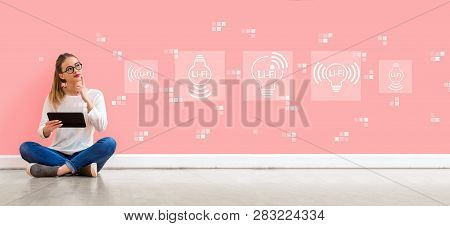 Lifi Theme With Young Woman Holding A Tablet Computer
