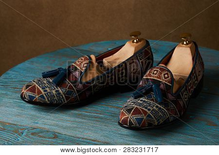 Fashionable Casual Mens Shoes On Wodden Table, Close-up