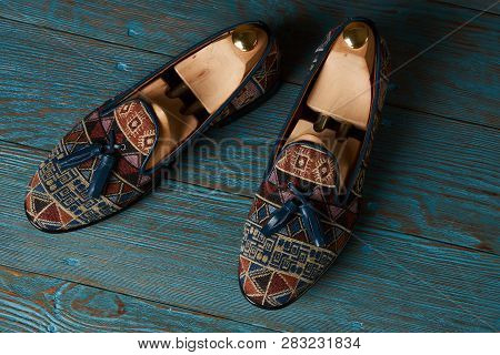 Fashionable Casual Mens Shoes On Wodden Table, Close-up