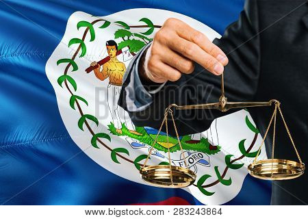 Belizean Judge Is Holding Golden Scales Of Justice With Belize Waving Flag Background. Equality Them