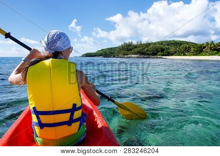 Young Woman Kayaking Near Drawaqa Island In Yasawas, Fiji. The Yasawa Group Consists Of 6 Main Islan