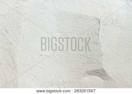 Concrete Wall Texture Background. Old White Wall With A Crack