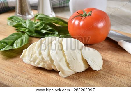 Slized Mozzarella Cheese, Tomato And Basil For Caprese Salad