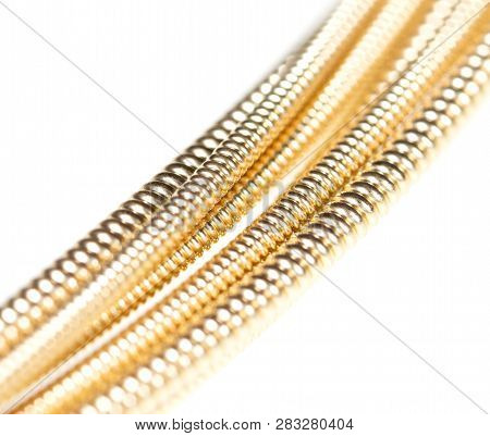 Strings For Guitar Isolated On A White Background. Macro