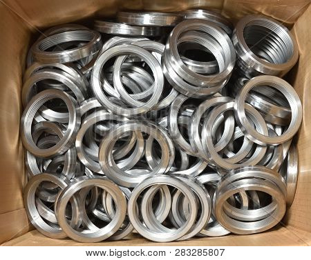 Round Rings With Internal Thread For Valve Manufacture In The Factory. Many Round Rings For Industri