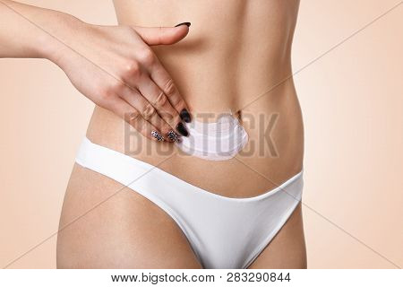 Image Of Woman Smears Body Cream, Has Soft And Smooth Skin Gets Rid Of Belly Fat, Has Black Manicure