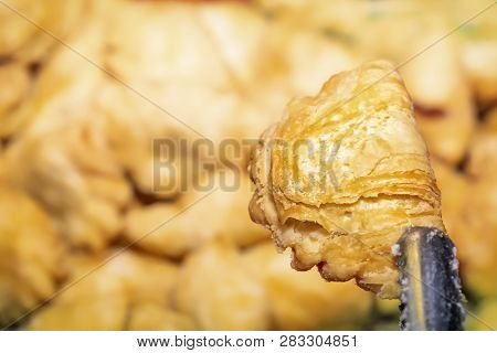 Traditional Asian Freshly Fried Puff Pastries In A Street Vending Tray. Close-up