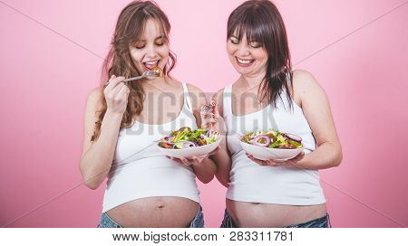 Maternity Concept, Two Pregnant Woman Eating Fresh Salad