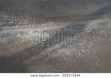 Deicing Chemicals On Asphalt Road In Moscow