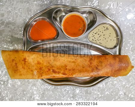 Masala Dosa And Idli Dosa Food Closeup With Selective Focus And Crop Fragment. It Is A Popular South