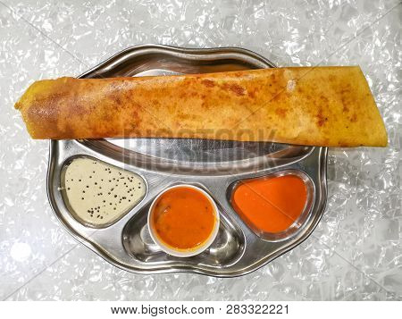 Masala Dosa And Idli Dosa Food Closeup With Selective Focus And Crop Fragment. It Is A Popular South