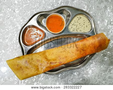 Masala Dosa And Idli Dosa Food Closeup With Selective Focus And Crop Fragment. It Is A Popular South