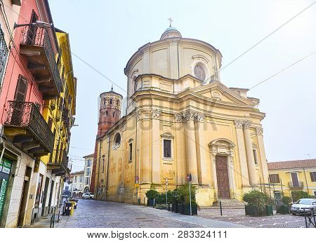 Asti, Italy - January 1, 2019. Main Facade Of The Chiesa Di Santa Caterina Church With The Torre Ros