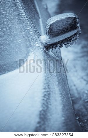 Close Up Shot Of A Frozen Car Mirror After Freezing Rain.