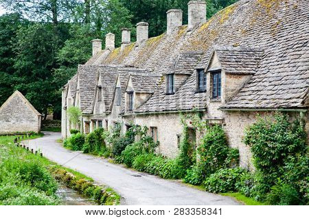 traditional Cotswold cottages in England, UK. Bibury is a village and civil parish in Gloucestershire, England