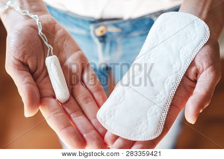 Woman Holding Menstrual Pad And Tampon, Life Style. Women's Health, Hygenic