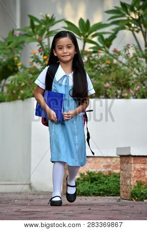 Filipina Girl Student Walking Wearing School Uniform With Notebooks