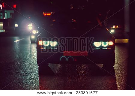 Night View Of The Cars. Road In The City At The Night With Yellow And Red Electrical Light For Cars 