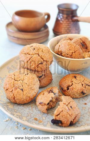 Nice And Healthy Dessert. Homemade Oatmeal Cookies With Dried Cranberries And Coffee In Cerve