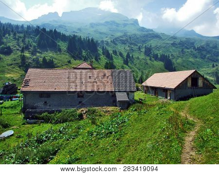 Alpine Livestock Farms And Stables On The Slopes Of Alvier Mountain In The Appenzell Alps Mountain R