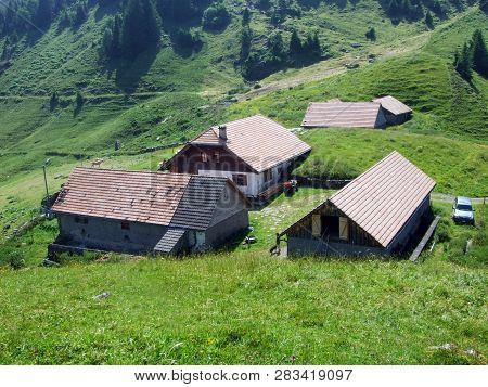 Alpine Livestock Farms And Stables On The Slopes Of Alvier Mountain In The Appenzell Alps Mountain R