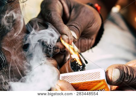 Varanasi India November 19, 2018 View Of A Unknown Sadhu Smoking A Chillum In The Streets Of Varanas